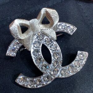 Brand new authentic CHANEL Silver and Champaign Brooch with crystals and Pouch